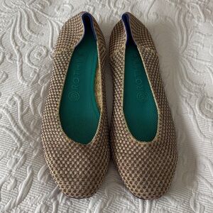 Rothy’s gold/tan with pink, teal, and blue sparkling checks. Size 10